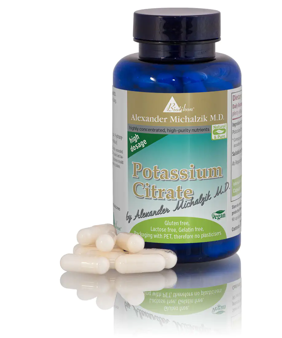 Potassium Citrate Capsules Blue bottle containing 500 mg potassium citrate capsules, individual capsules on the table.