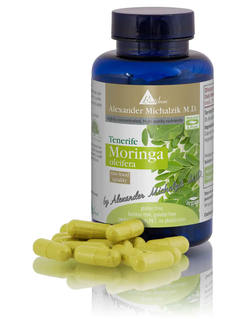 Moringa Oleifera Capsules – 90 Count Moringa oleifera capsules in yellow, 90 pieces in a blue glass container, side view.