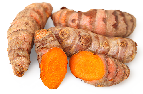 Turmeric Root – 500 g Fresh turmeric roots, orange slices, on a white background.