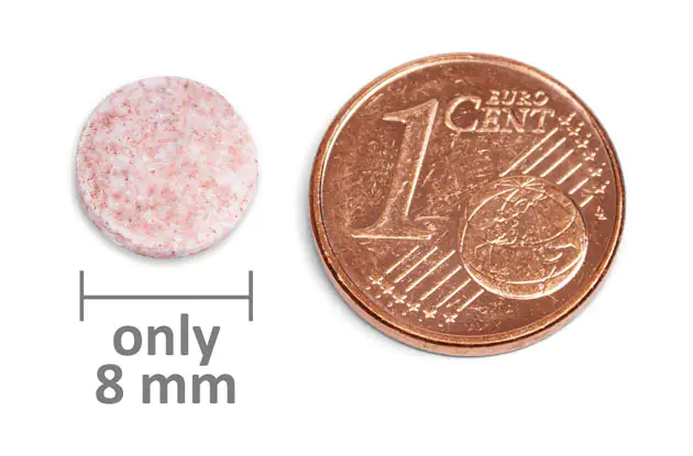 Nutrient Tablet – 8 mm Pink nutrient tablet, 8 mm in diameter, shown next to a 1-cent coin for size reference.