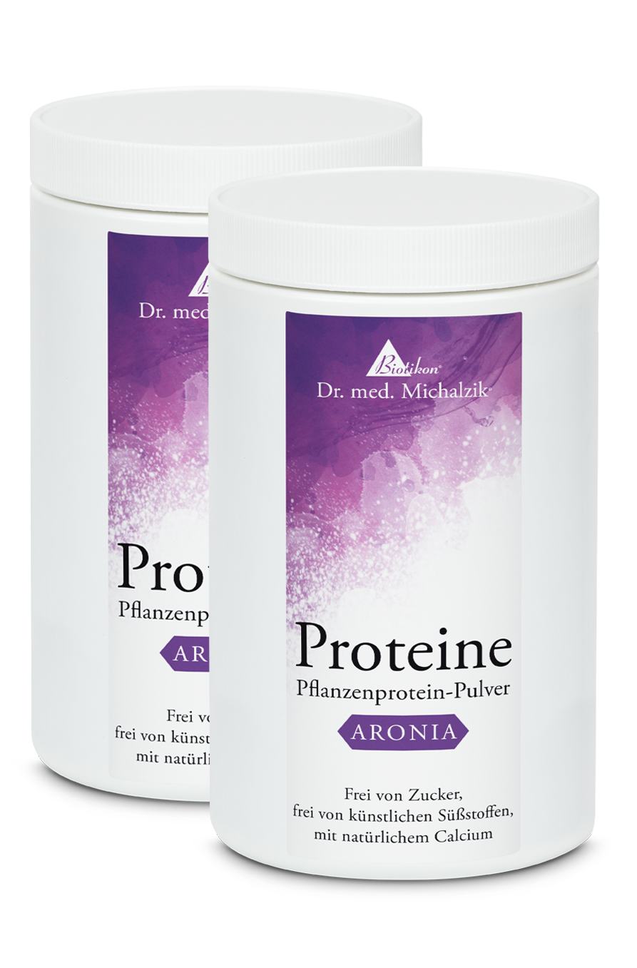 Aronia Plant Protein Powder – 500 g Two containers of white plant protein powder with a purple label, 500 g.