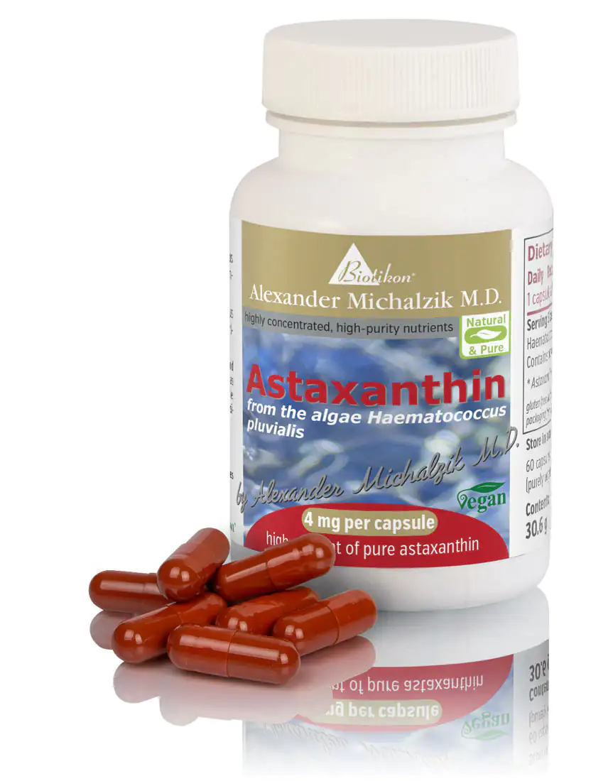 Astaxanthin 4 mg – Capsules Bottle of red Astaxanthin capsules, 60 pieces, vegan formula, on a reflective surface.